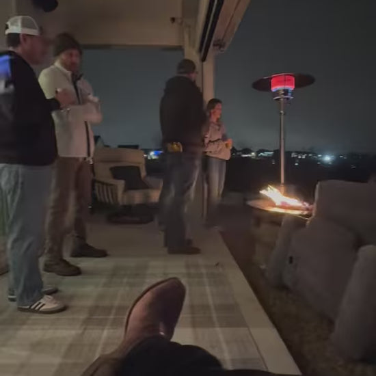 Backyard movie night showing Super Bowl on a 20-foot inflatable screen with friends and family gathered outdoors.