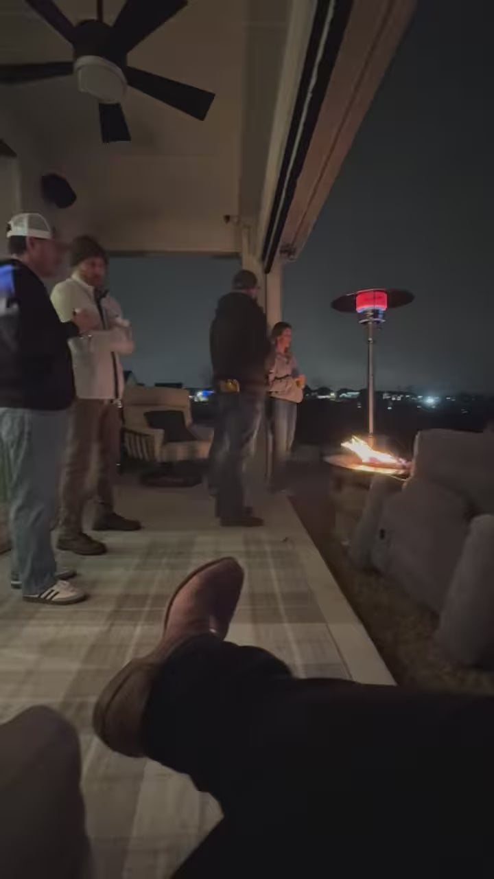 Backyard movie night showing Super Bowl on a 20-foot inflatable screen with friends and family gathered outdoors.